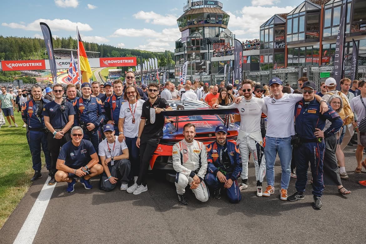 Team and guests together trackside at a GT3 race weekend